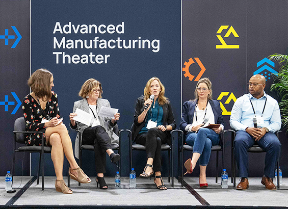A panel of four women and one man speakers